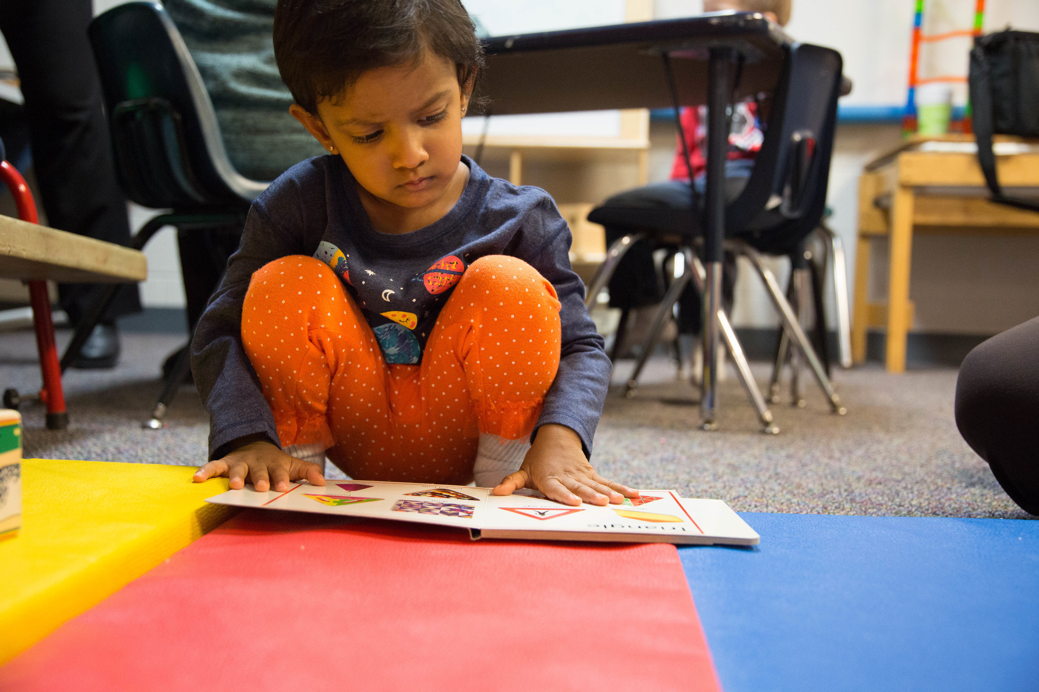 Child Looking at Book